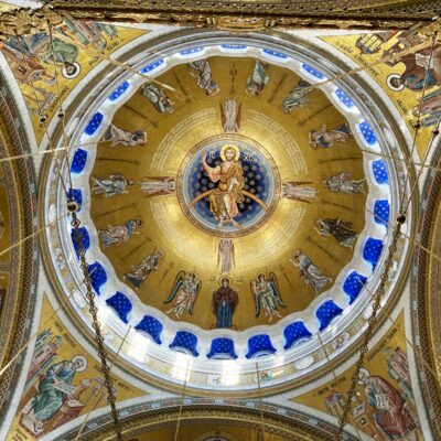 the ceiling of a church with paintings on it